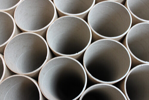 cardboard industrial tubes row of them